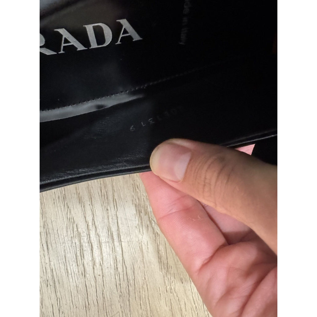 Prada Triangle logo pointed loafers 11